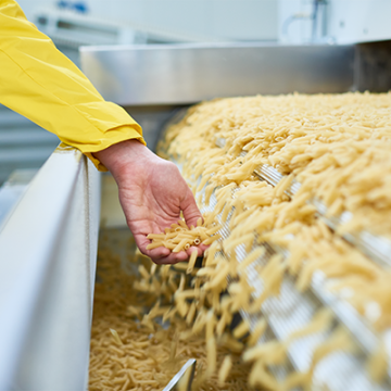 female-hand-catching-spilling-macaroni