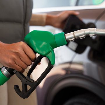 view-woman-with-car-gas-station-2